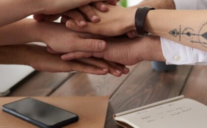 photo of people near wooden table